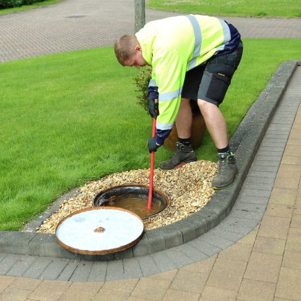 A blocked drain being unblocked by one of our drain experts