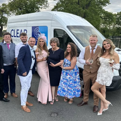 A photo of the Clear Drainage Solutions admin team at Dan & Tracys wedding in front of a CDS drainage van