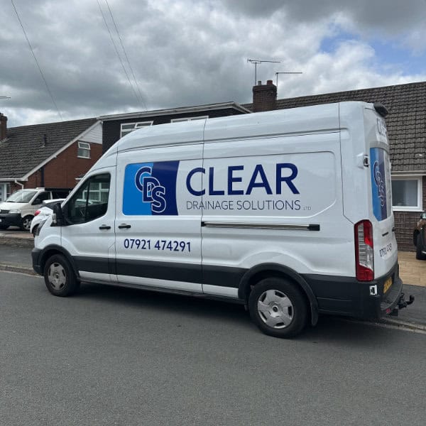 A Clear Drainage Solutions van parked outside a customer property